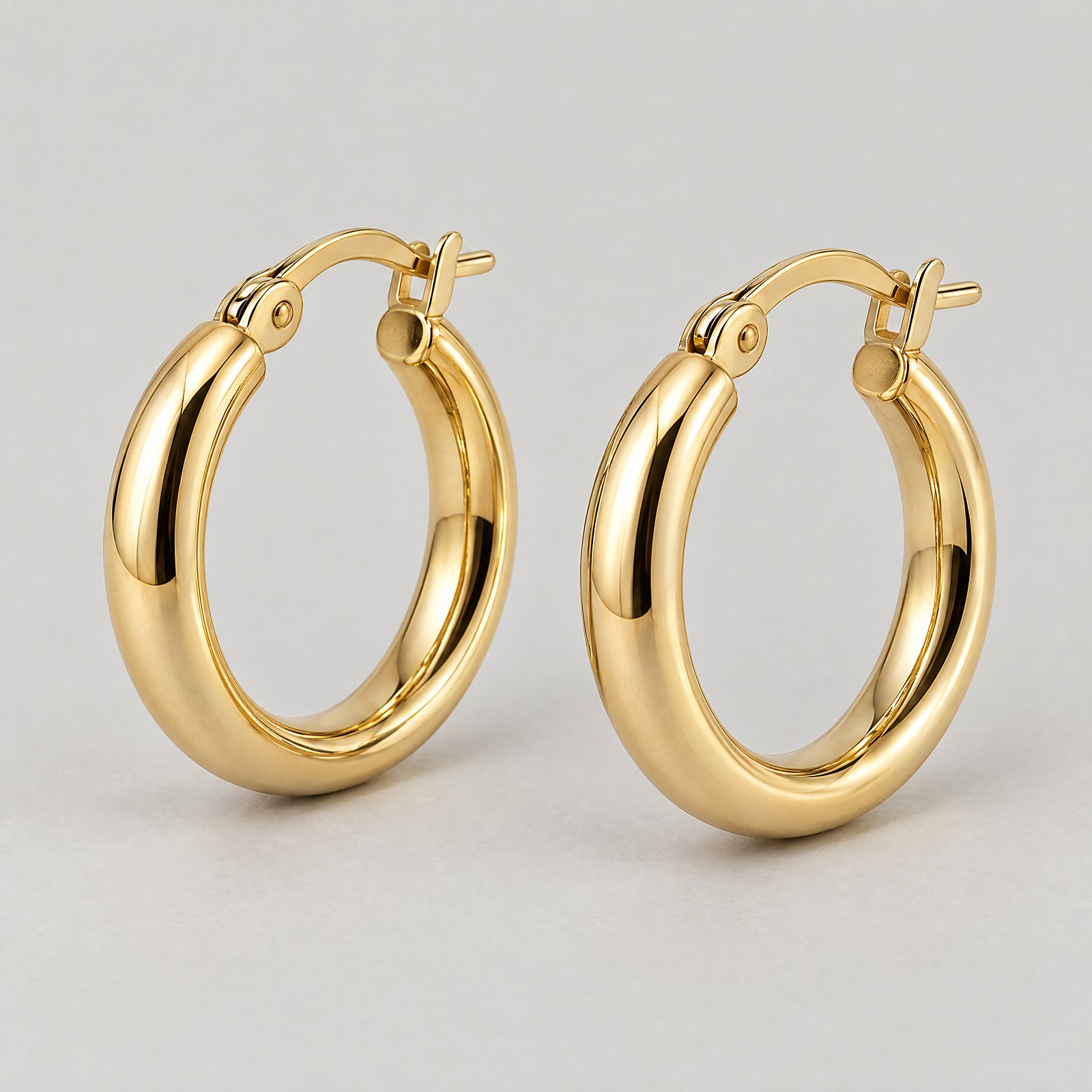 Gold Hoop Earrings in yellow gold â angled view